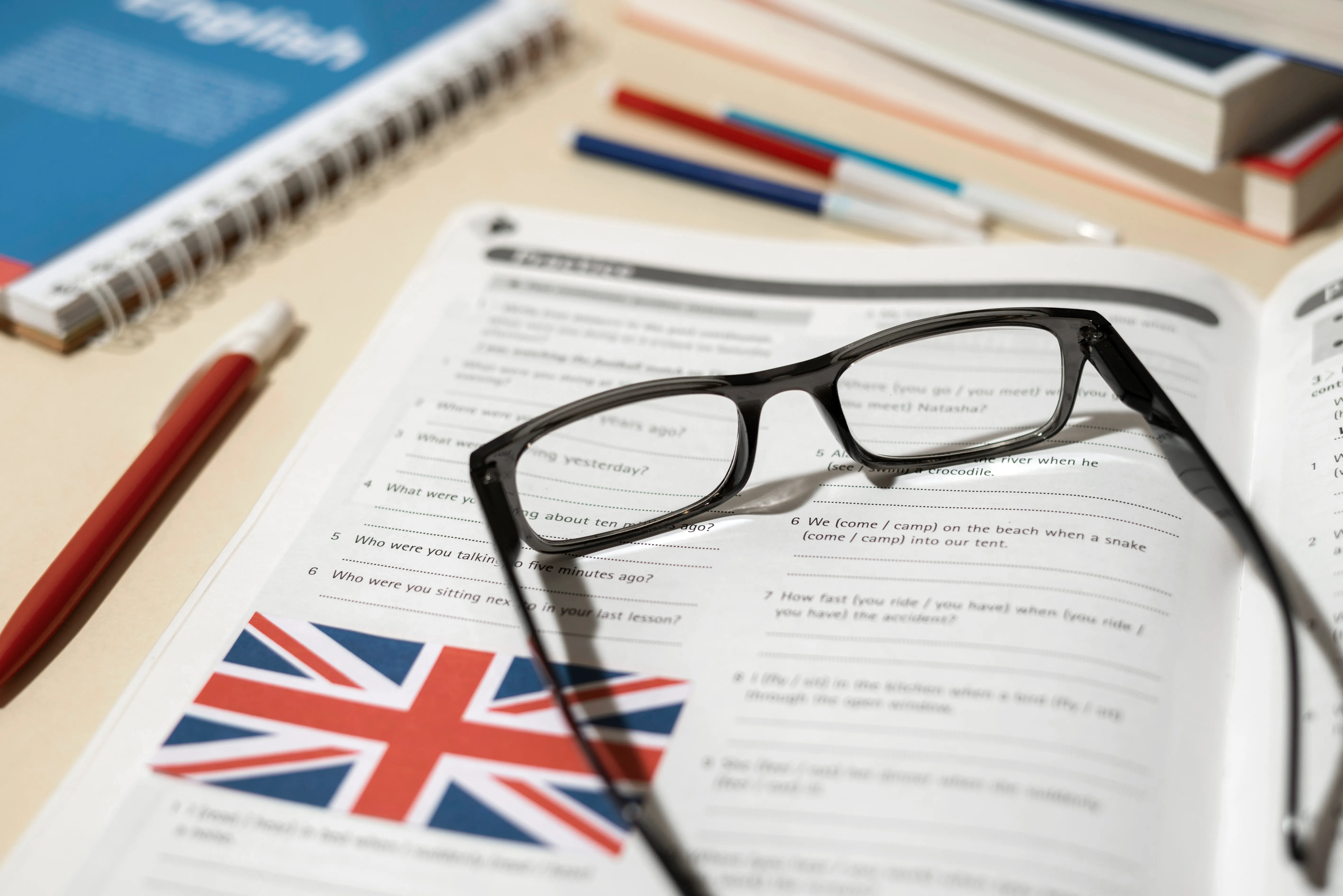 English book with glasses on the table